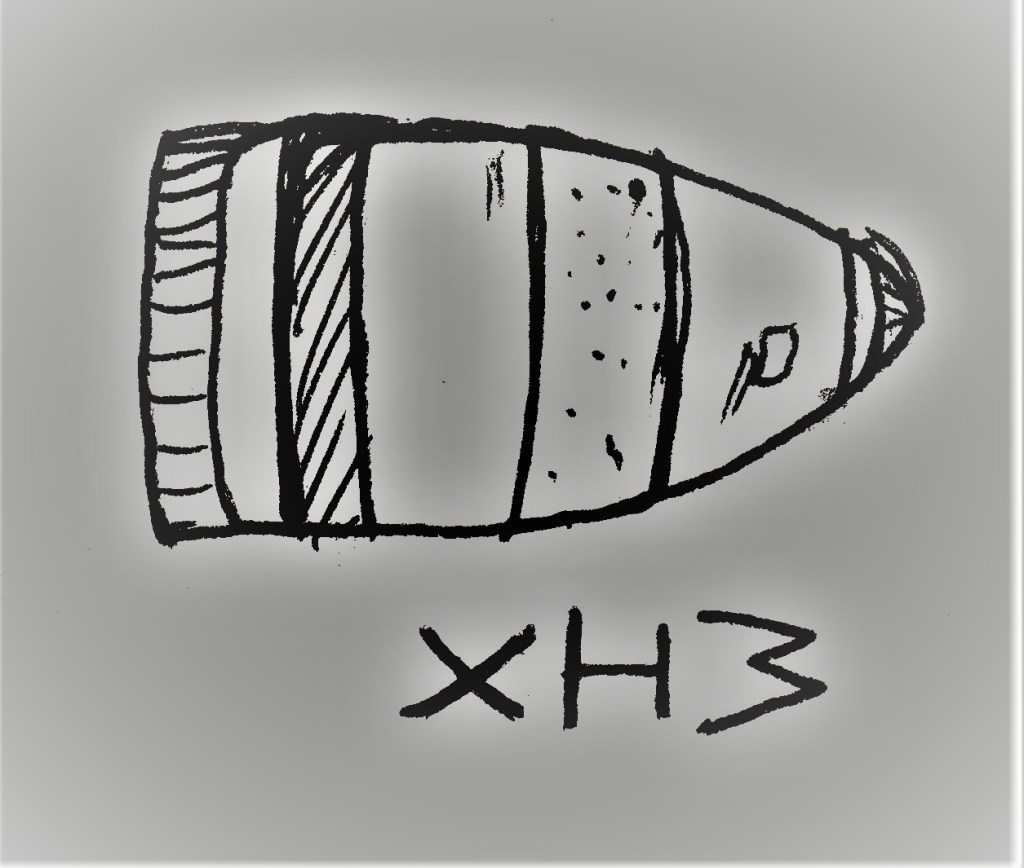 missile or bullet, striped, "XH3" beneath